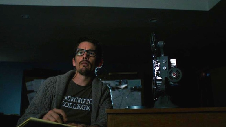 Ellison Oswalt watching Super 8 films in Sinister