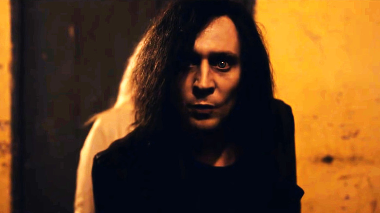 Tom Hiddleston stares