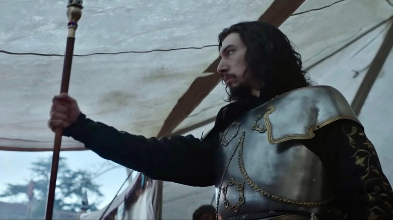 Jacques le Gris raises a scepter in The Last Duel
