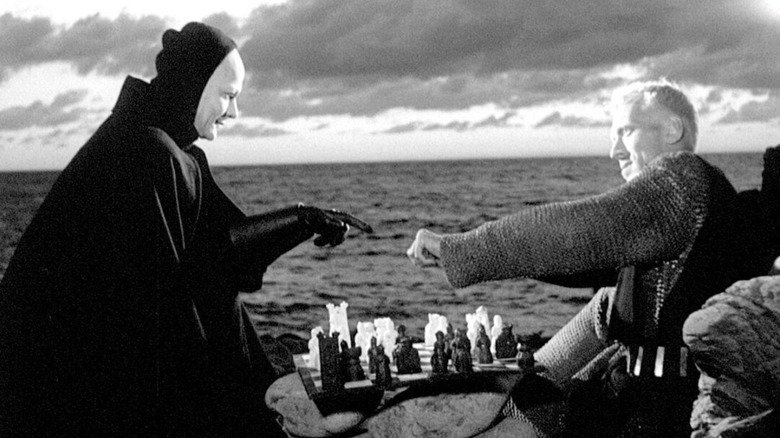 Block and Death play chess in front of the ocean in The Seventh Seal