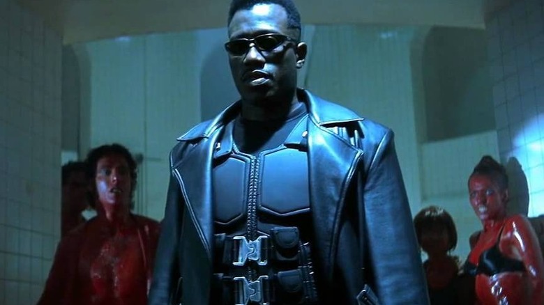 Blade stands in front of bloodied people in "Blade" (1998)