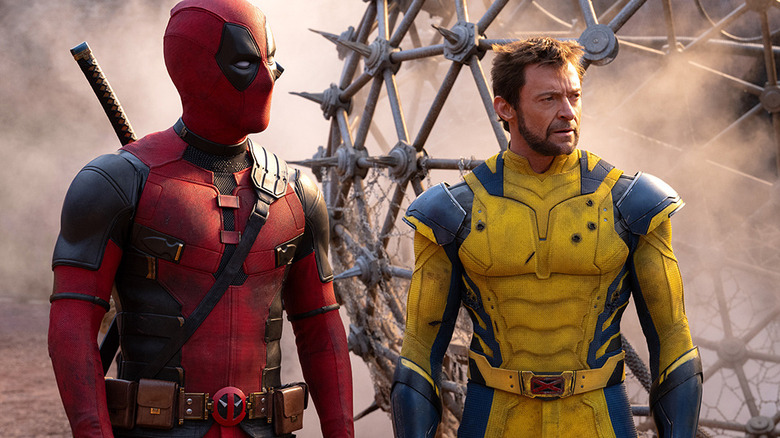 Deadpool and Wolverine stand in front of a spiked structure in "Deadpool and Wolverine" (2024)