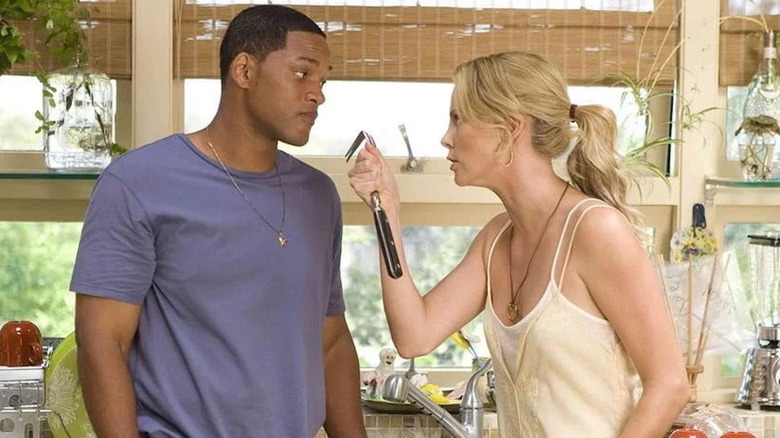 Mary brandishes a tool at Hancock in "Hancock" (2008)