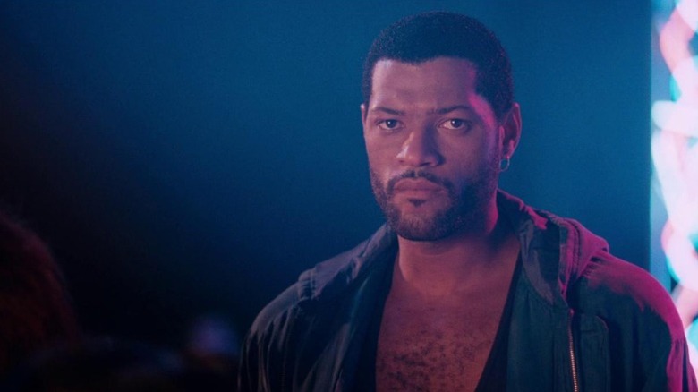 Agent Russell Stevens Jr. standing under neon lights with his shirt open in "Deep Cover" (1992)