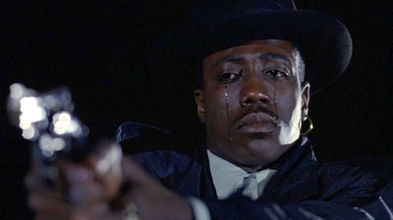 Nino Brown pointing a gun and crying in "New Jack City" (1991)