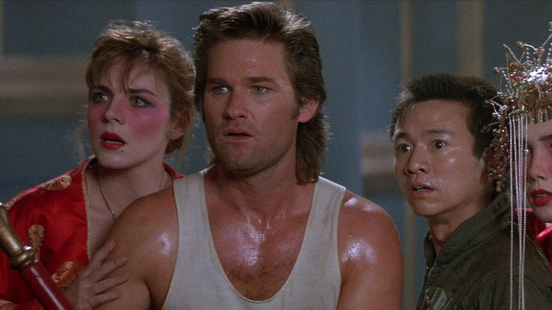 Jack stands in front of Gracie, Wang-Chi, and Miao Yin in Big Trouble in Little China (1986)