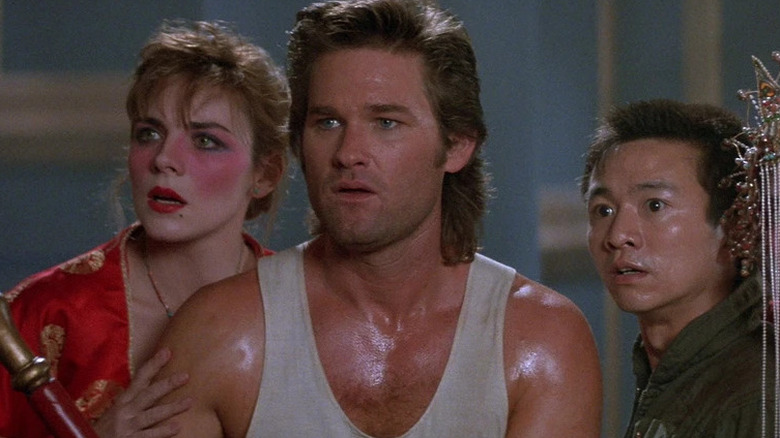 Jack stands in front of Gracie, Wang-Chi, and Miao Yin in Big Trouble in Little China (1986)