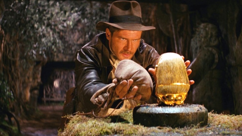 Indiana Jones switches out a golden idol for a sack of sand in Indiana Jones and the Raiders of the Lost Ark (1981)