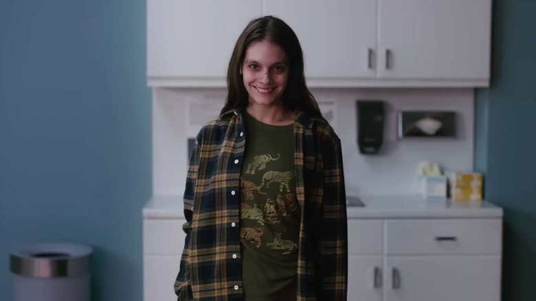 Laura smiling in a terrifying way in Smile
