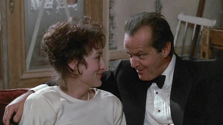 Rachel and Jack smiling at each other at an event in Heartburn