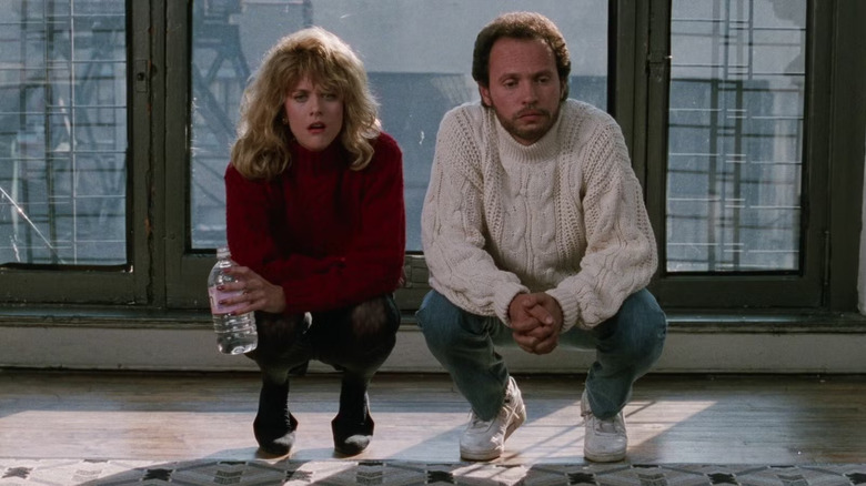 Sally and Harry squatting on his living room floor in When Harry Met Sally