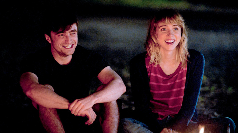 Wallace and Chantry sitting on the beach in The F Word (What If)