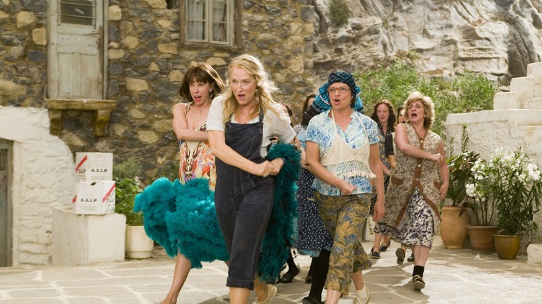 Donna Sheridan leading a crowd of dancers