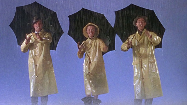Singin' in the Rain's three leads crooning in a storm