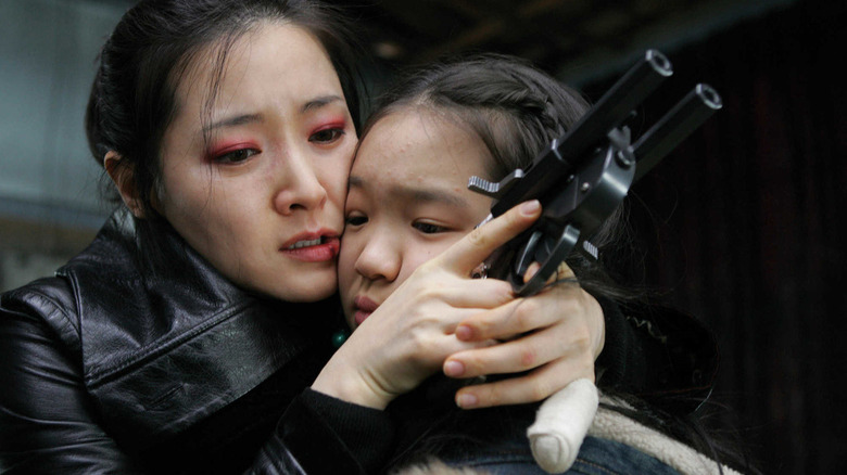 Lee Geum-ja protects Jenny in "Lady Vengeance" (2005)