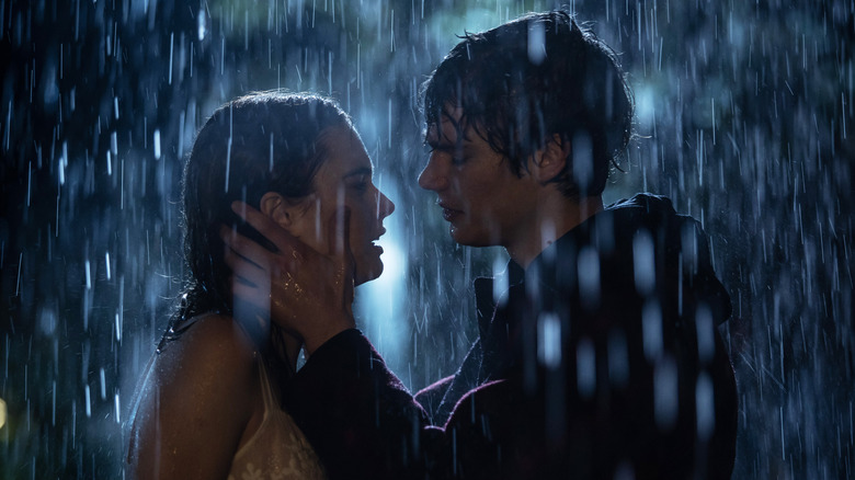Nica and Rigel embracing in the rain in "The Tearsmith."