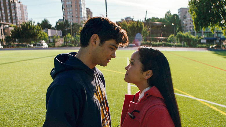 Peter and Lara Jean standing on a field in "To All the Boys I've Loved Before."