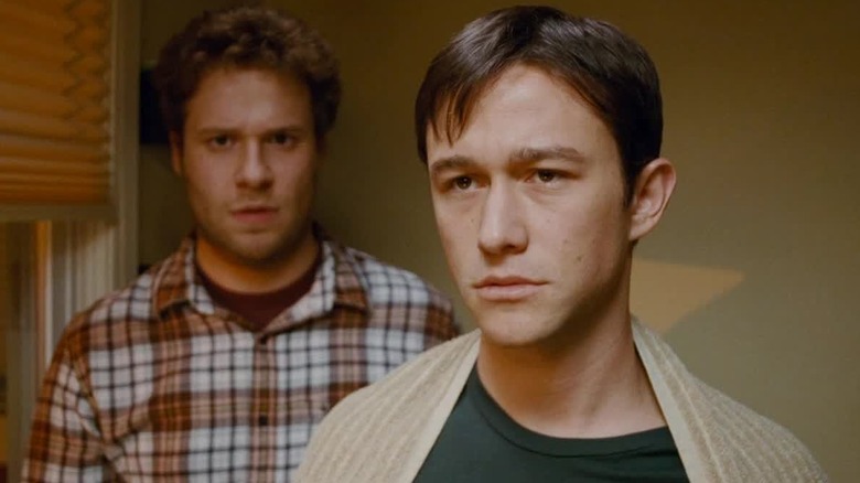 Adam and Kyle looking into a mirror in "50/50" (2011)