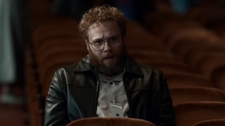 Steve Wozniak sits in an empty row of chairs in "Steve Jobs" (2015)