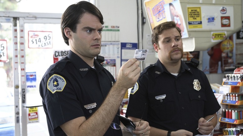 Officers Michaels and Slater investigate in a convenience store in "Superbad" (2007)