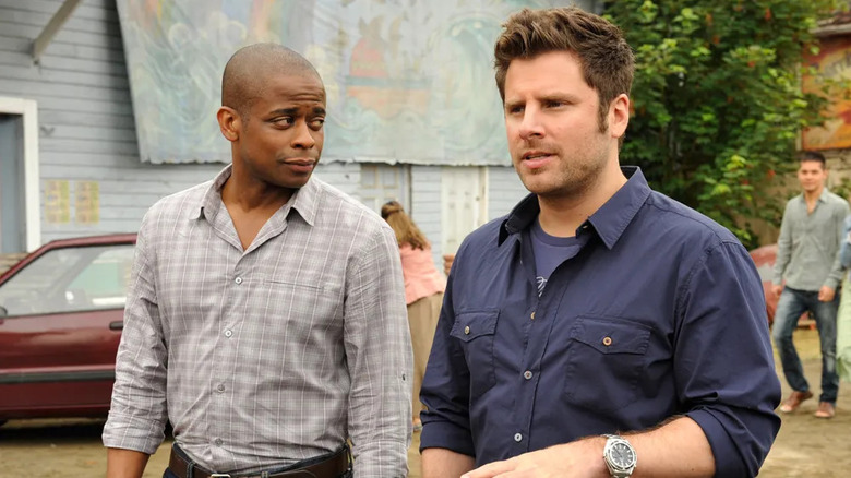 Shawn looking at something and Gus looking skeptical on Psych