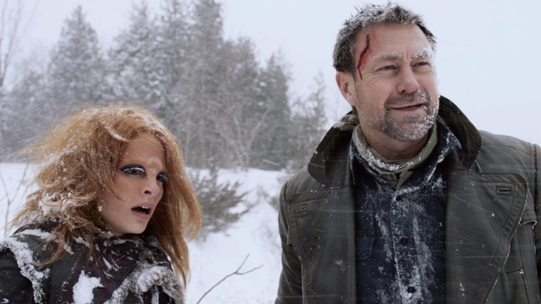 Nolan and Irisa walk in the snow in "Defiance" (2013-2015)