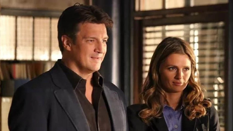 Castle standing next to Beckett