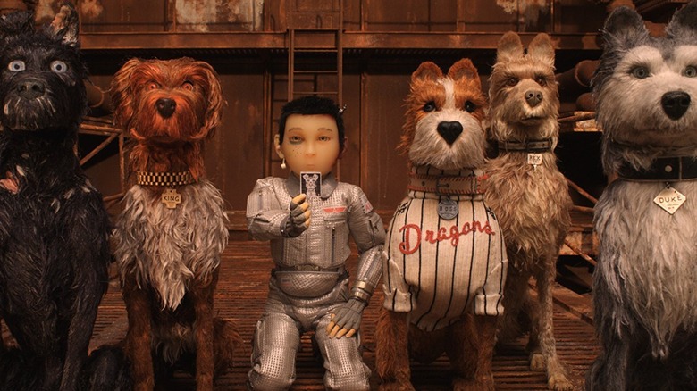 Atari and several dogs together in "Isle of Dogs"