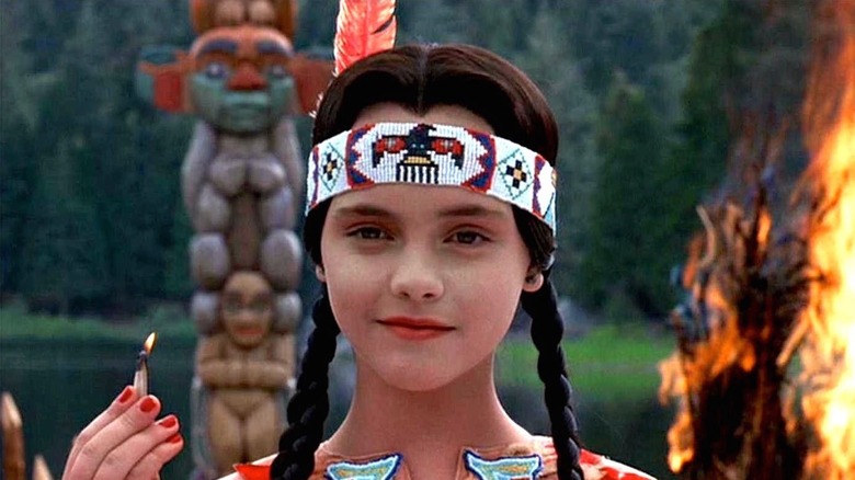 Wednesday holding a match in "Addams Family Values"