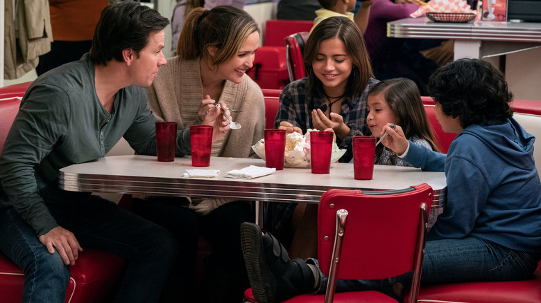 The Wagner family sitting at a diner in "Instant Family"