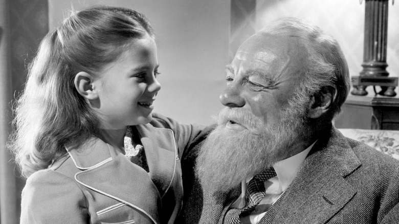 A young girl smiling at Kris Kringle in "Miracle on 34th Street"