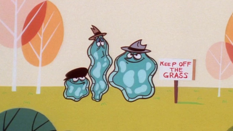 The Amoeba Boys stand on grass next to a "Keep Off the Grass" sign in "The Powerpuff Girls" (1998-2005)