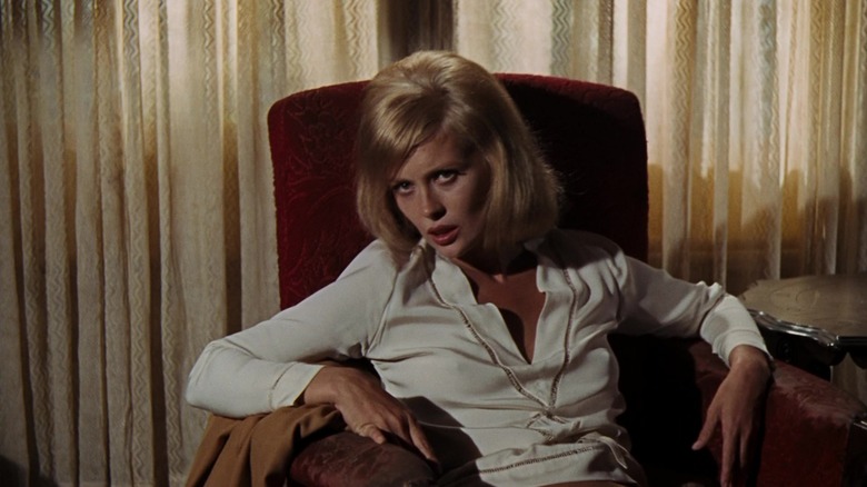 Bonnie reclining in armchair in "Bonnie and Clyde"