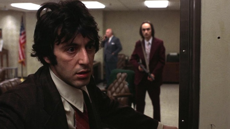 Sonny wearing horrified expression while Sal holds gun in "Dog Day Afternoon"