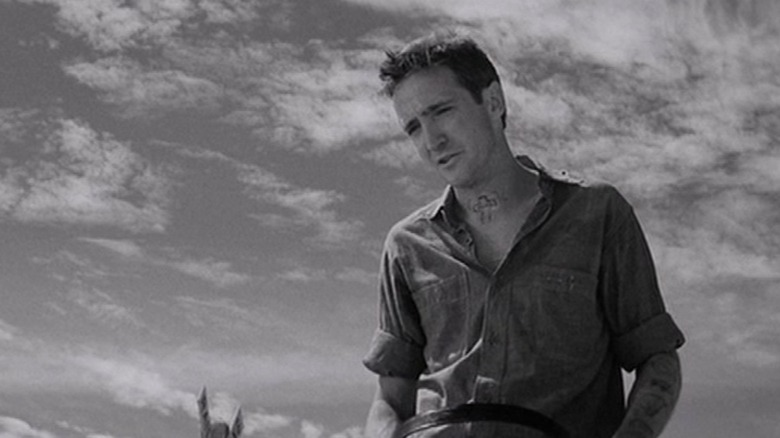 Dick Hickock from "In Cold Blood" silhouetted against an open sky
