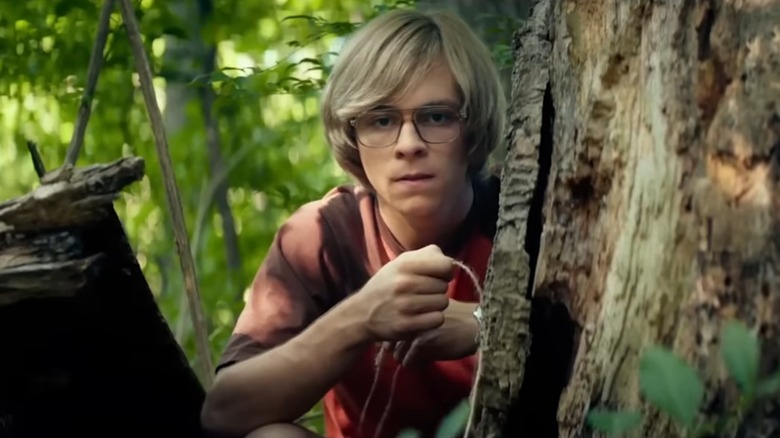 Young Jeffrey Dahmer setting an animal trap in "My Friend Dahmer"
