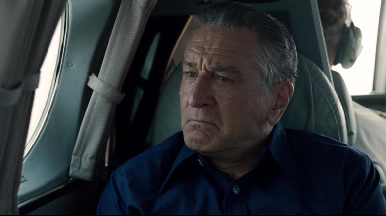 Frank Sheeran from "The Irishman" sitting in an airplane crying