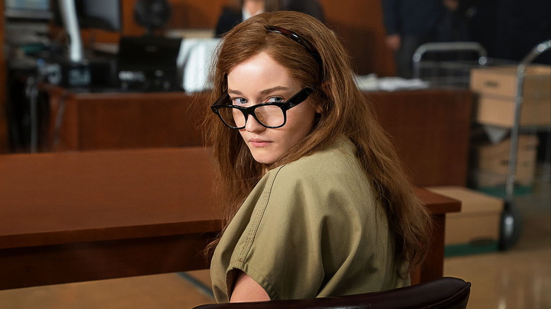 Anna in court, turns to look over her shoulder in Inventing Anna