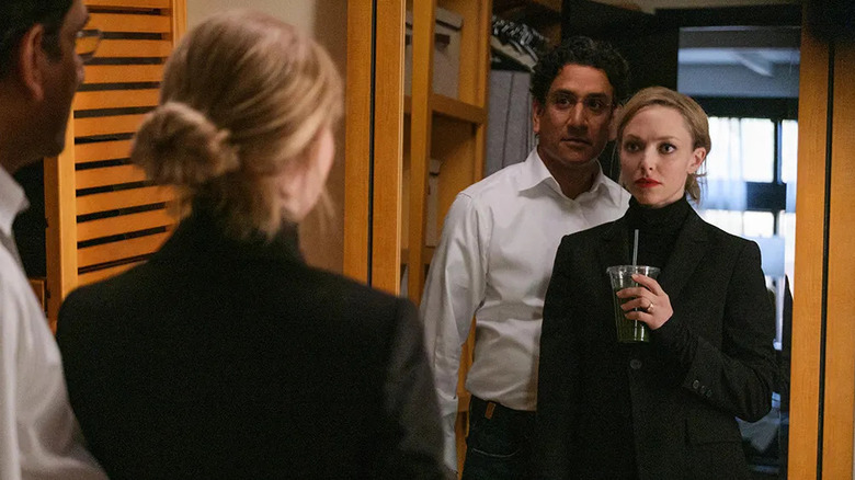 Sunny and Elizabeth stand in front of a mirror in The Dropout