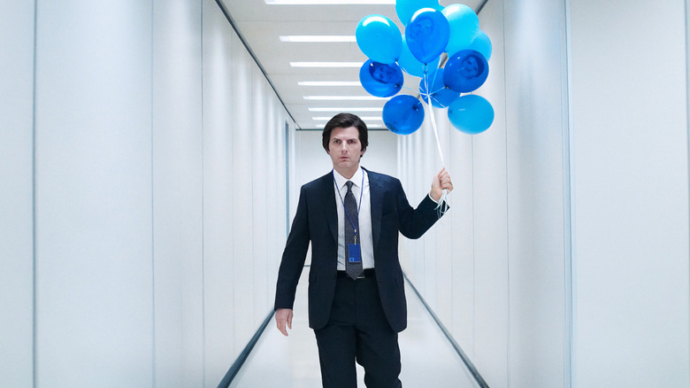 Mark S. carrying a bundle of balloons through a white hallway in "Severance"