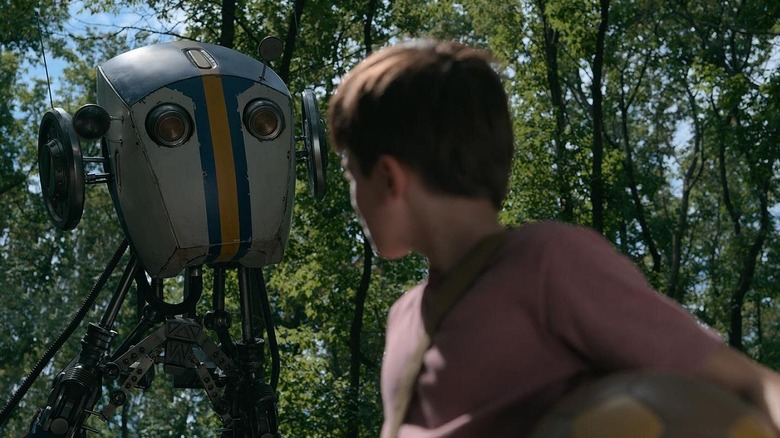 A child looking at a robot in a forest in "Tales from the Loop."
