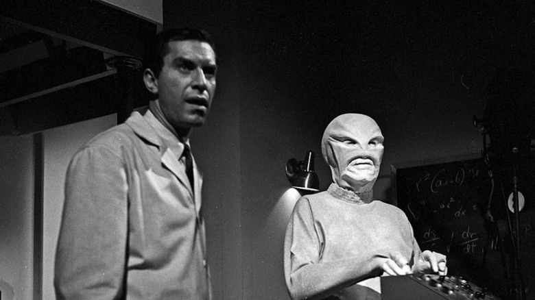 A man and an alien in a classroom in "The Outer Limits."