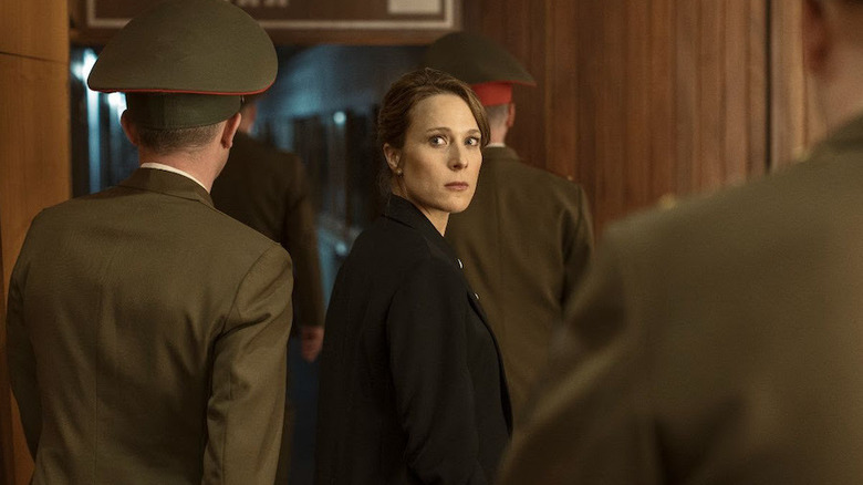 Ewa surrounded by soldiers in "The Eastern Gate."
