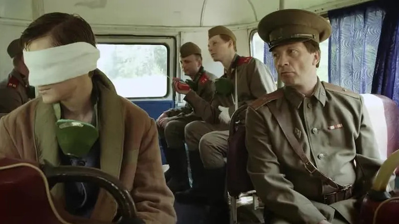 A general oversees a bus full of soldiers in Inseparable