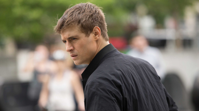 Joe looks suspicious on the street in Condor