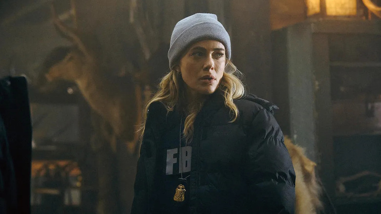 Bex looks over her shoulder in The Hunting Party