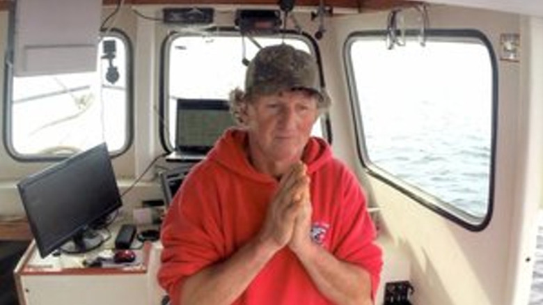Captain Jeff prays in "Catching Monsters" (2015)