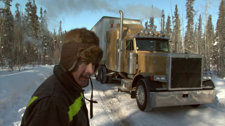 A trucker scans the road ahead in "Ice Road Truckers" (2007-2017)