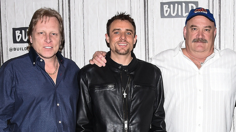 Sig Hansen, Jake Anderson, and Keith Colburn smiling together in 2018