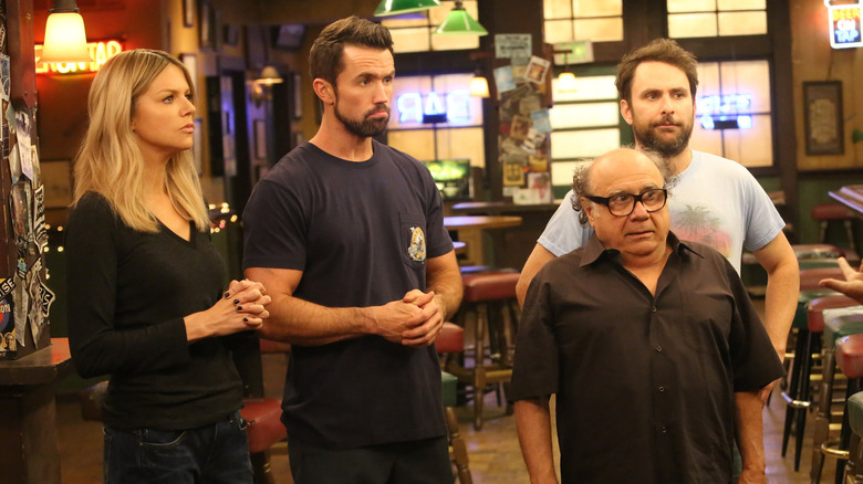 Dee Mac Frank and Charlie looking confused in the bar on It's Always Sunny in Philadelphia